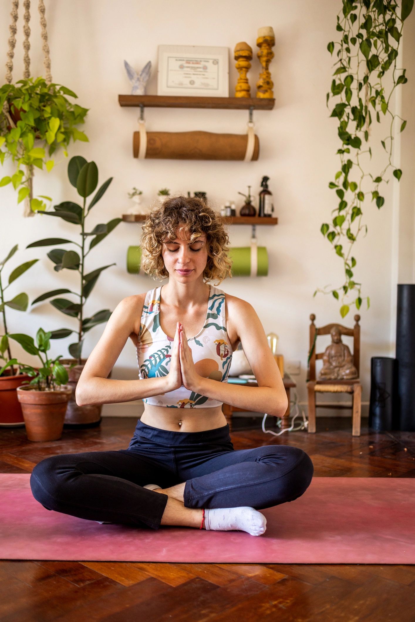 Woman practicing yoga at home in a peaceful setting