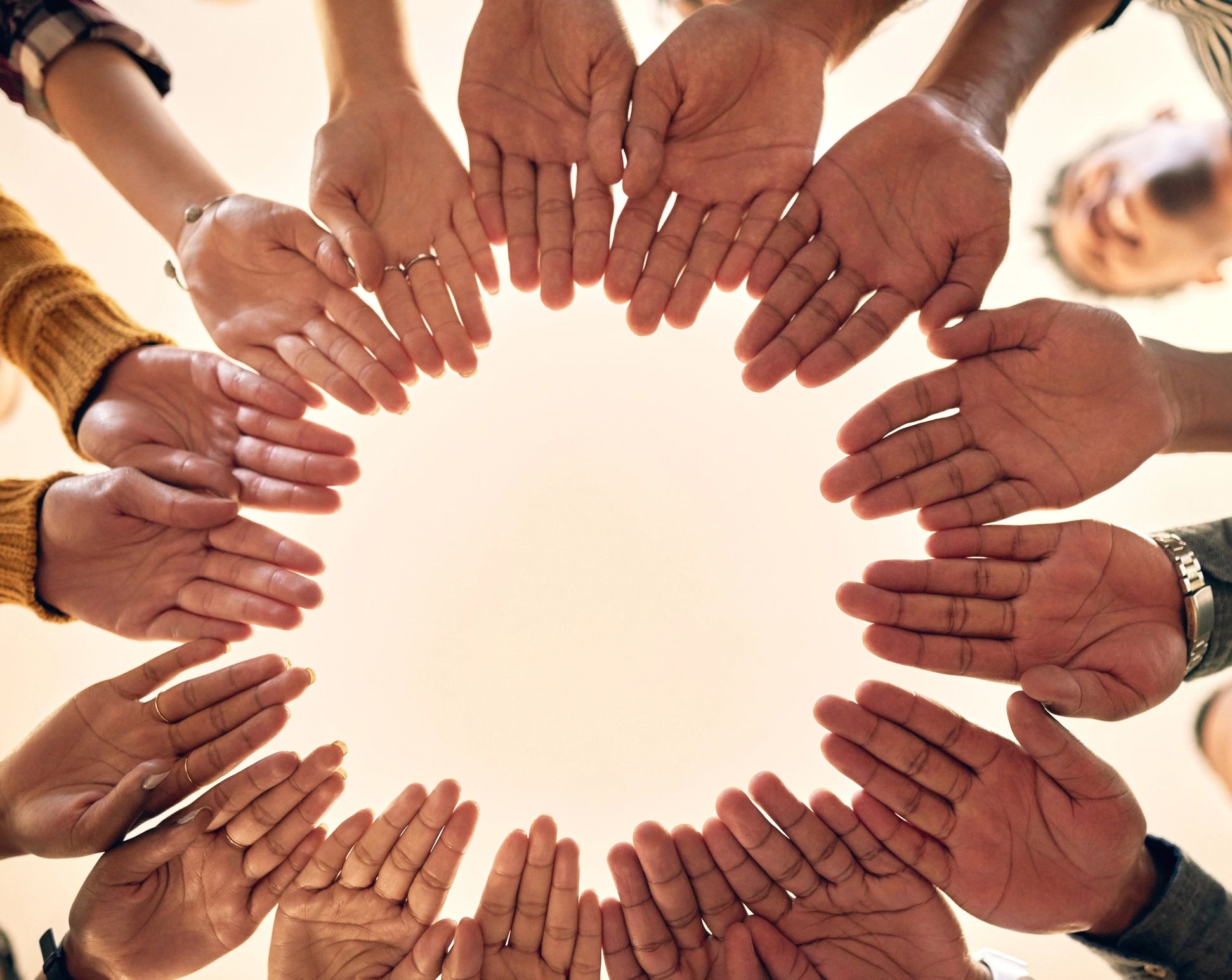 Community members joining hands together